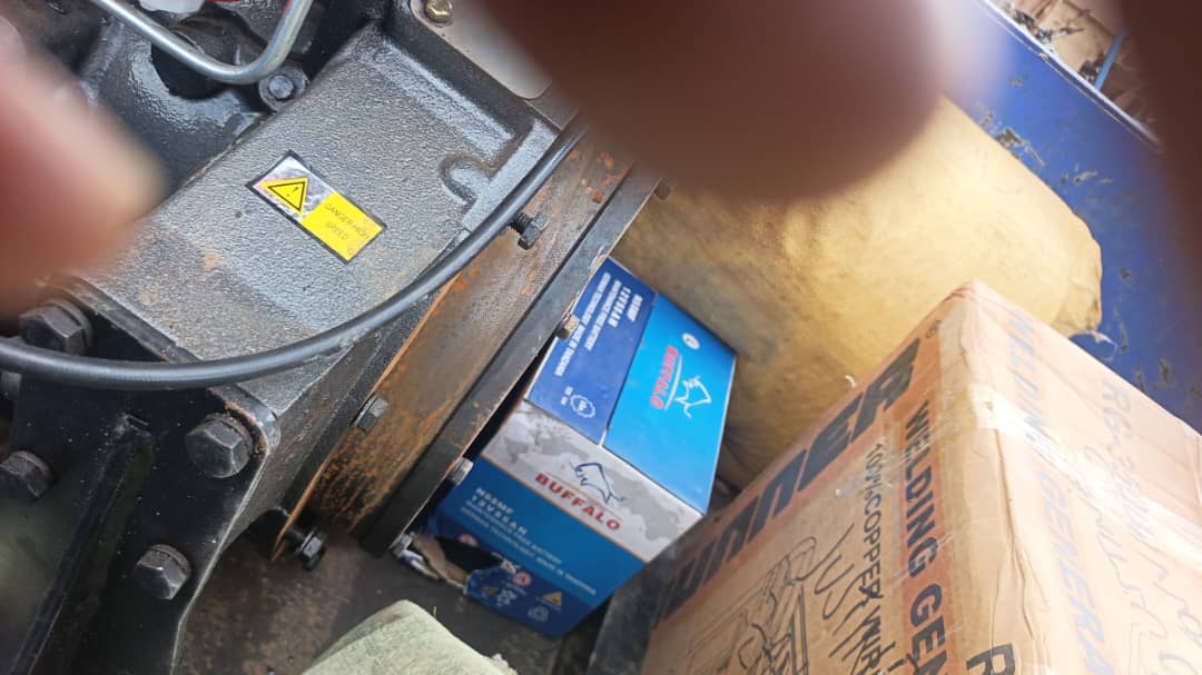 Engine assembly detail with Buffalo battery boxes and welding electrodes