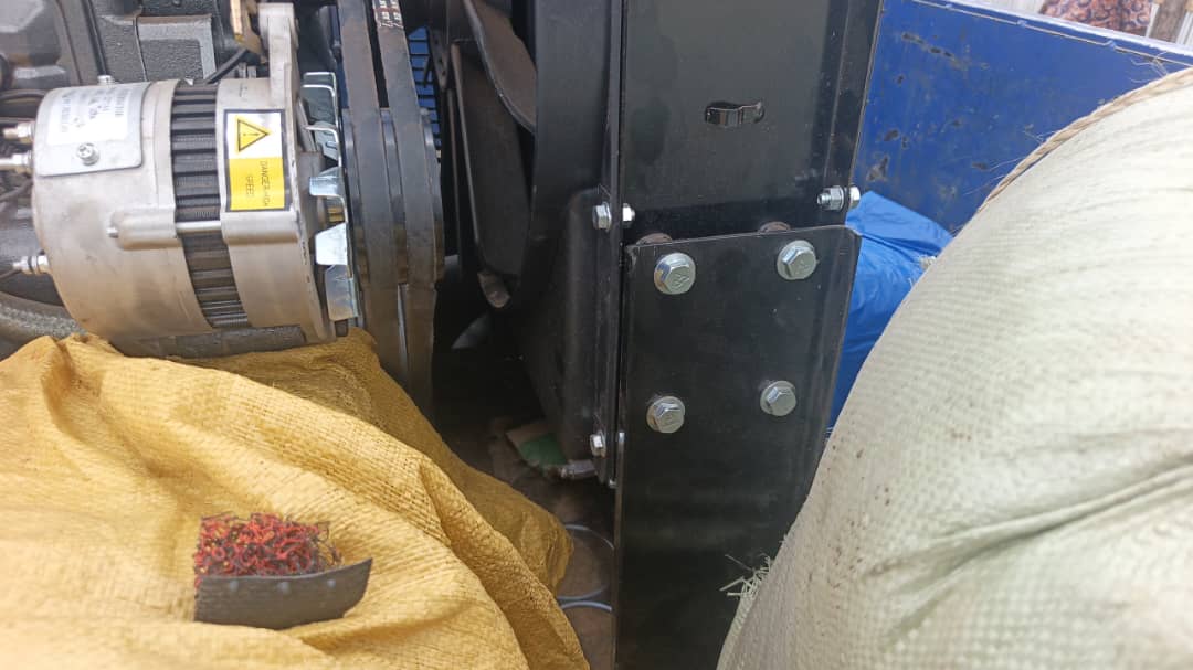 Detail of the alternator and belt on the engine